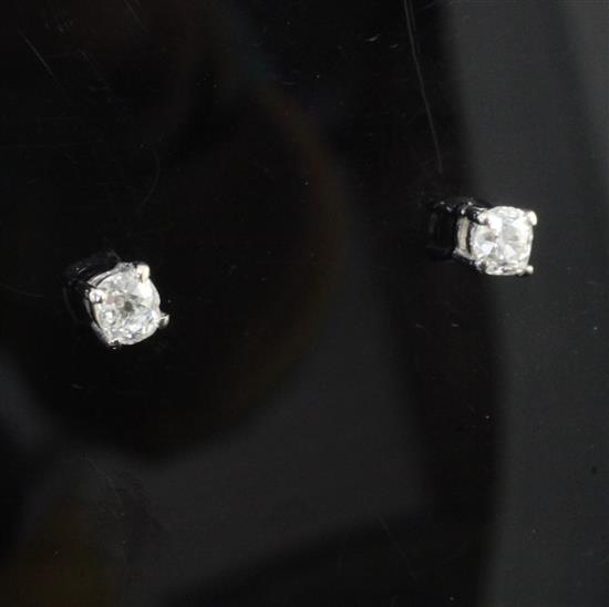 A pair of 18ct gold and solitaire diamond ear studs,